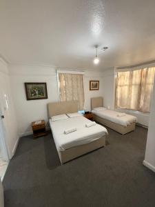 Ένα ή περισσότερα κρεβάτια σε δωμάτιο στο The Birchwood Lodge