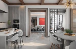 a kitchen and dining room with a table and chairs at Arvesto Lux Jakarta in Jakarta