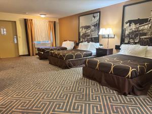 a hotel room with two beds in a room at Super 8 by Wyndham Laurel in Laurel