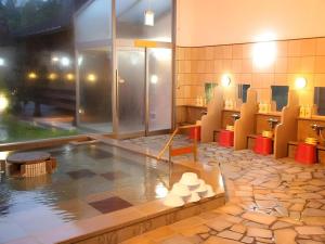 a bathroom with a pool of water in a room at Hotel Royal Hill Fukuchiyama and Spa in Fukuchiyama +73 photos