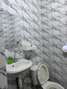 a bathroom with a toilet and a sink at Mini studio in Dakar