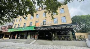 a building with a store in front of it at James Joyce Coffetel·Shanghai Zhuanqiao Wanda Plaza in Shanghai