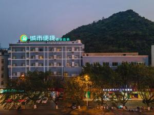 a hotel with a sign on top of a building at City Comfort Inn Liuzhou The Mixc Xijiang Road in Liuzhou