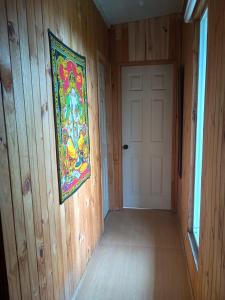 a painting hanging on the wall of a room at Habitación cómoda en Pelluco in Puerto Montt