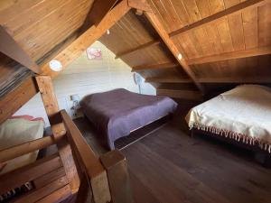 an attic room with two beds in a attic at Les Bungalows les Vanilliers, Sud Sauvage avec piscine in Saint-Joseph +166 photos