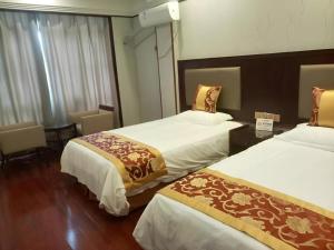 Postel nebo postele na pokoji v ubytování Shell Hotel Wuxi Jiangyin Zhutang Town