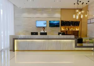 TV a/nebo společenská místnost v ubytování City Comfort Inn Luocheng Bus Terminal