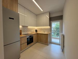 Η κουζίνα ή μικρή κουζίνα στο Olea Suites Family