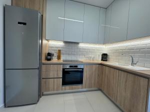 Η κουζίνα ή μικρή κουζίνα στο Olea Suites Family +11 φωτογραφίες