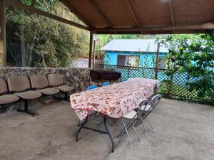 a table and chairs sitting on a patio at Hostal Kaiheke in Hanga Roa