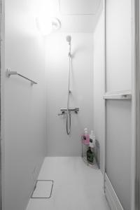 a white bathroom with a shower and a toilet at TARUNE in Otaru +93 photos