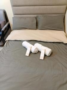 two towels on a bed with price tags on them at Stena Stays in Kaybagal