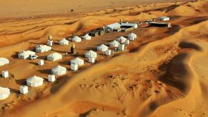 an aerial view of a desert village in the desert at Alsarmadi Desert Camp in Shāhiq
