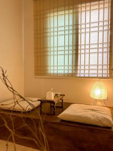 Ένα ή περισσότερα κρεβάτια σε δωμάτιο στο Pocket Seoul Branch 2