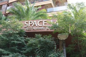 a building with a sign that reads space restaurant at Dreamland Oasis 14-704 apartment in Chakvi +67 photos