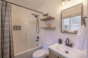 a bathroom with a sink and a shower and a toilet at Peak Pursuit Jacuzzi, Sauna, Game Room, Renovated in Sugarloaf +26 photos
