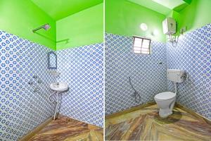 Un baño verde con inodoro y lavabo. en Super Hotel O Rishra Railway Station Formerly Green Guest House, en Khardah