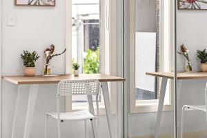 a table and chairs in a room with a window at Sleek & Comfortable Ensuite Double Room at Revesby with Shared Kitchen in Revesby +21 photos