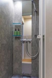 a bathroom with a shower with a sink at mion in Kyonan +80 photos