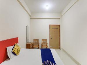 Una cama o camas en una habitación de HOTEL O PRAFULA PALACE