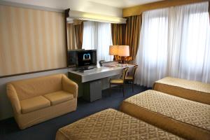 TV a/nebo společenská místnost v ubytování Hotel Maxim