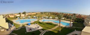 an aerial view of a resort with two swimming pools at One Bedroom Chalet at Gardenia Al Wadi in Ain Sokhna