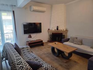a living room with a couch and a coffee table at center apartments in Lefkada Town
