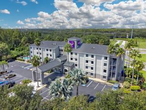 an aerial view of a hotel with a parking lot at Sleep Inn near Busch Gardens - USF in Tampa