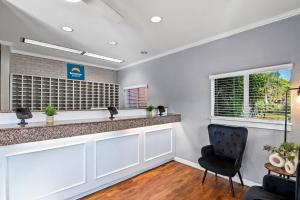 a bar in a waiting room with a chair at Suburban Studios Stuart near Federal Hwy 1 in Stuart