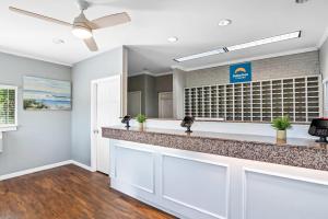a bar in a dental office with a ceiling fan at Suburban Studios Stuart near Federal Hwy 1 in Stuart