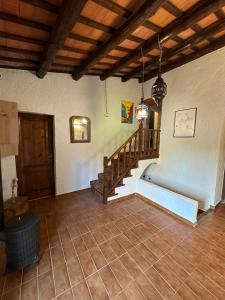 a room with a staircase and a stair case at Charming village house for families & cyclists in Juià