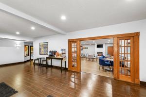 an open living room with a dining room and a kitchen at Comfort Inn Rhinelander in Rhinelander