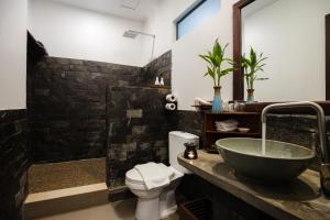 a bathroom with a sink and a toilet at Green Amazon Residence in Siem Reap