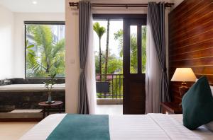 Ένα ή περισσότερα κρεβάτια σε δωμάτιο στο Green Amazon Residence +47 φωτογραφίες