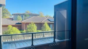 a balcony with a view of a house at Residence Of Frankcom in Blackburn