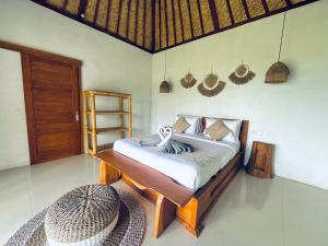 Ένα ή περισσότερα κρεβάτια σε δωμάτιο στο Hillside bali +24 φωτογραφίες