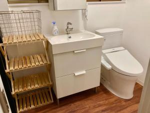 a bathroom with a white sink and a toilet at ＡＴＴＡ ＨＯＴＥＬ ＫＡＭＡＫＵＲＡ - Vacation STAY 16380v in Kamakura +15 photos