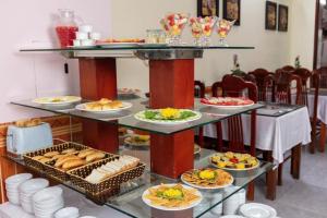 a buffet with many plates of food on display at Viet Village Hotel in Hanoi