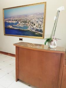 A television and/or entertainment centre at Lena Hotel