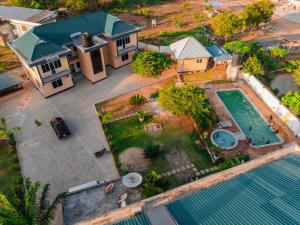 an aerial view of a house with a swimming pool at Cashewnut Hotel in Mtwara