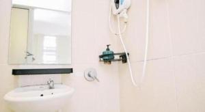a white bathroom with a shower and a sink at My Home Hotel Wangsa Maju in Kuala Lumpur +58 photos