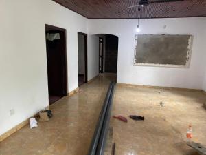 a room under construction with a blackboard on the wall at Ryo hostel in Ahangama