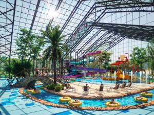 a large water park with a water slide at Amadria Exclusive Beach Villa in Šibenik