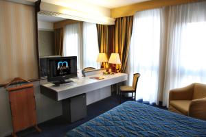 TV a/nebo společenská místnost v ubytování Hotel Maxim