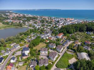 an aerial view of a town with houses and the water at Wohnpark Stadt Hamburg - Apt. 15 in Binz