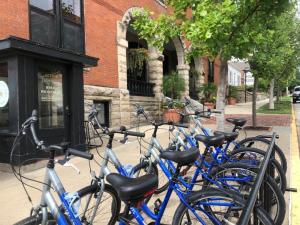 a row of blue bikes parked in front of a building at Hotel Frederick in Boonville