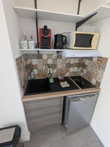 Kuchyň nebo kuchyňský kout v ubytování Studio 26