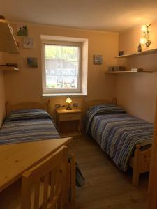 Ένα ή περισσότερα κρεβάτια σε δωμάτιο στο Appartamento LatteMiele