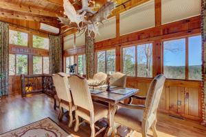 a dining room with a table and chairs at Hilltop Hideaway in Highlands
