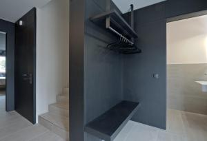 a staircase in a room with a black wall at Z-Apartment Parkgasse in Schladming +2 photos